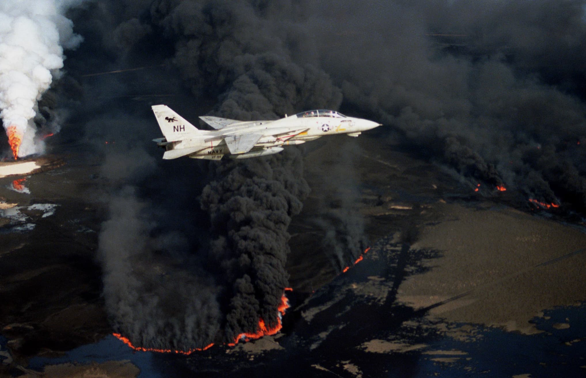 planes fly over burning kuwait oil fields - Nh Navy Vf 84